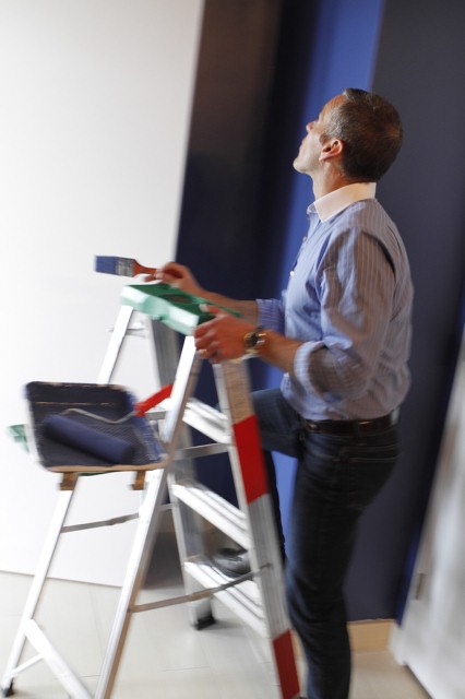 Tom paints a bathroom an intense shade of blue.