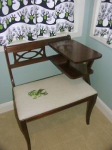 Embroidered dragon on vintage telephone table. Embroidered dragon on vintage telephone table.