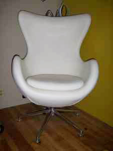 White leather swivel chair, $299.