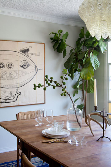 Emily's dining space features this curious blimp art.