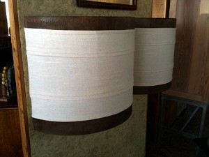 re_store_sconce Sconces made from reclaimed mesh cylinder cut in half and wrapped with linen.