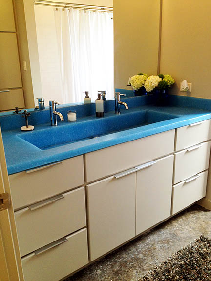 Memorable details like this funky blue counter/sink really make a space!