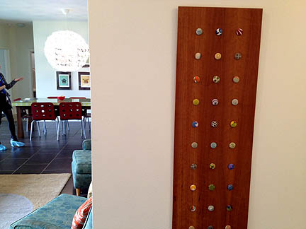 Sheri Bingham made this button display for her Iron Thread Design furniture. It looks so great, she uses it as art!