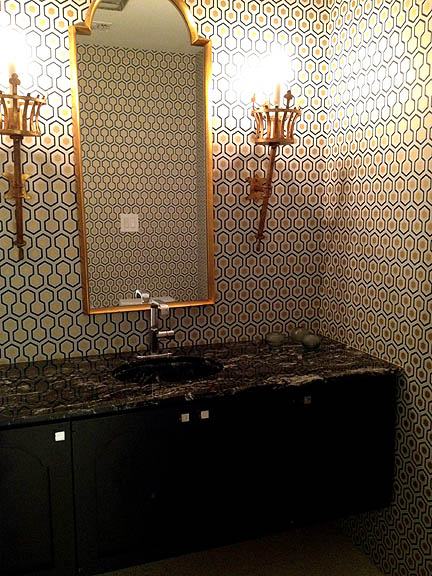 More great wallpaper in this glam powder room.
