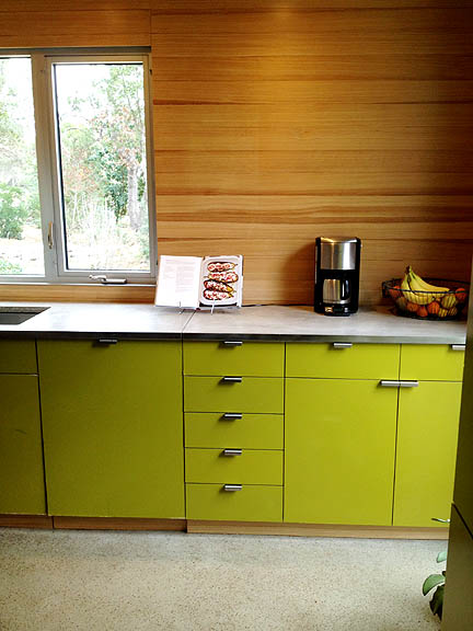 Natural wood tempers the lime green in this kitchen.