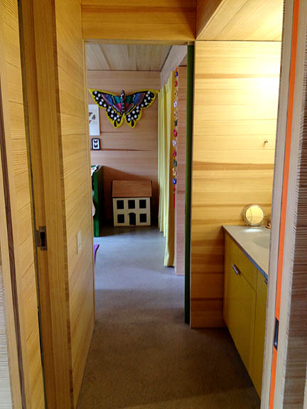 Also note the slivers of Kelly green and bright orange pocket doors on the right!