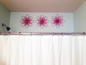 IMG_2152 These hot pink metal flowers peeking over the top of Phoebe's bathtub are indestructible pieces of bathroom art.