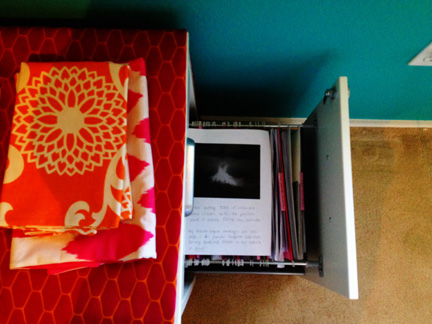 Feng shui reminders--a picture of a volcano erupting in my wealth & prosperity corner.