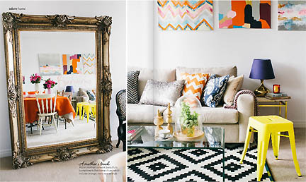 This spread in the Feb/Mar 2013 issue of Australia's online home decor magazine, Adore, features a black & white ikat rug and colorful pillows and art.