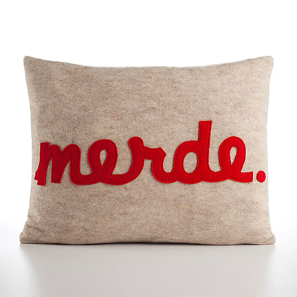 Merde modern decorative lumbar pillow in red and natural.
