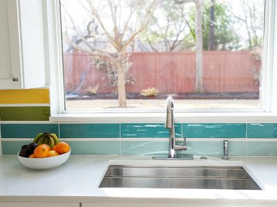 Sink detail in colorful kitchen remodel in Austin TX designed by Room Fu - Knockout Interiors.