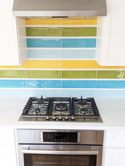 Modern kitchen update in brilliant hues of aqua, turquoise, citron green, and golden yellow. Designed by Room Fu.