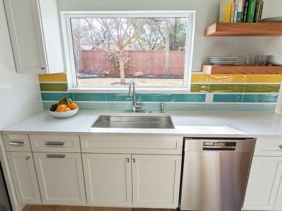 Enlarged window at sink in Austin, TX colorful kitchen remodel designed by Room Fu - Knockout Interiors.